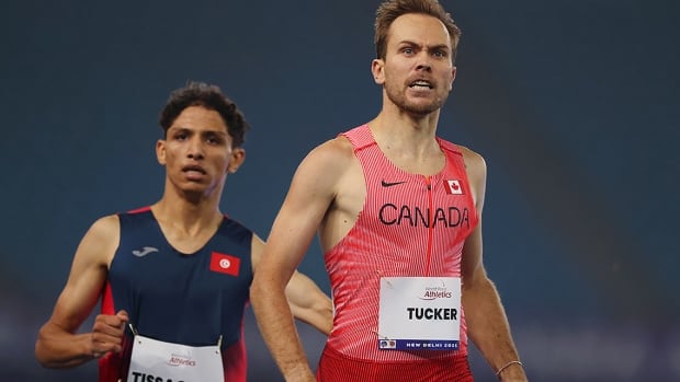 Para runner Nate Tucker of Canada celebrates after winning a gold medal in the men
