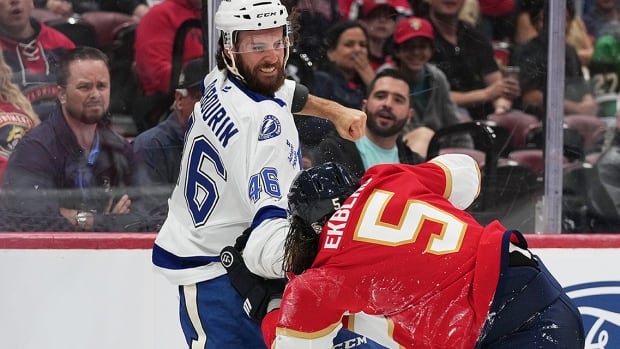 Tampa Bay Lightning right-winger Scott Sabourin and Florida Panthers defenceman Aaron Ekblad trade blows during the first period of an October 4, 2025 NHL regular-season game in Sunrise, Florida.
