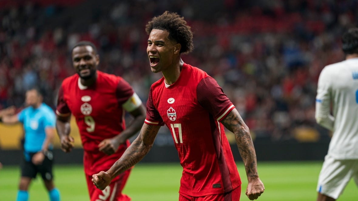 A soccer player celebrates.