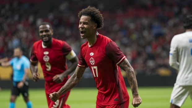 A soccer player celebrates.