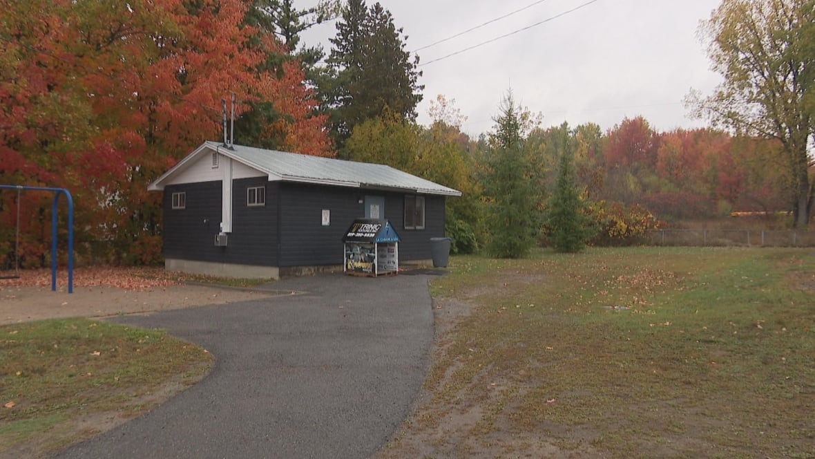 A shack in a park in fall.