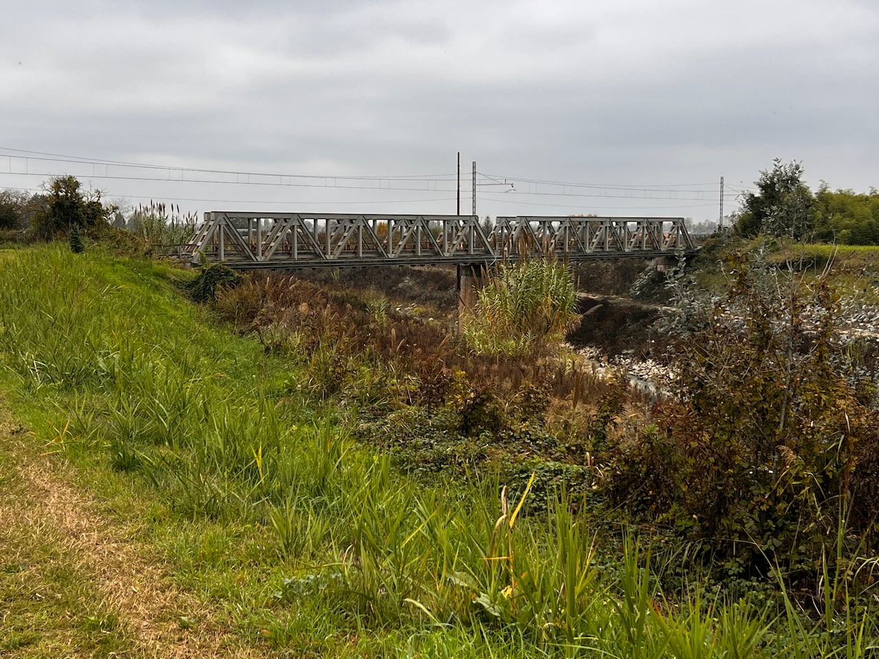 A railway bridge is shown in modern Italy.