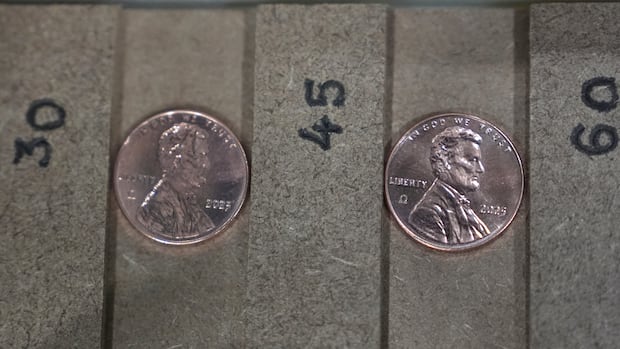 Two of the last five pennies pressed at the U.S. Mint were presented during a news conference in Philadelphia, Wednesday, Nov. 12, 2025. (AP Photo/Matt Slocum) A close-up image of two newly minted U.S. pennies