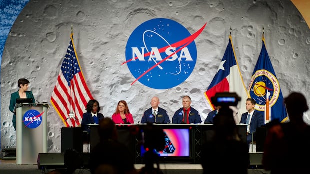 A sheet of six radical sits onstage astatine a NASA event, framed by the NASA logo connected a satellite backdrop, with flags of the USA and Texas beside them.