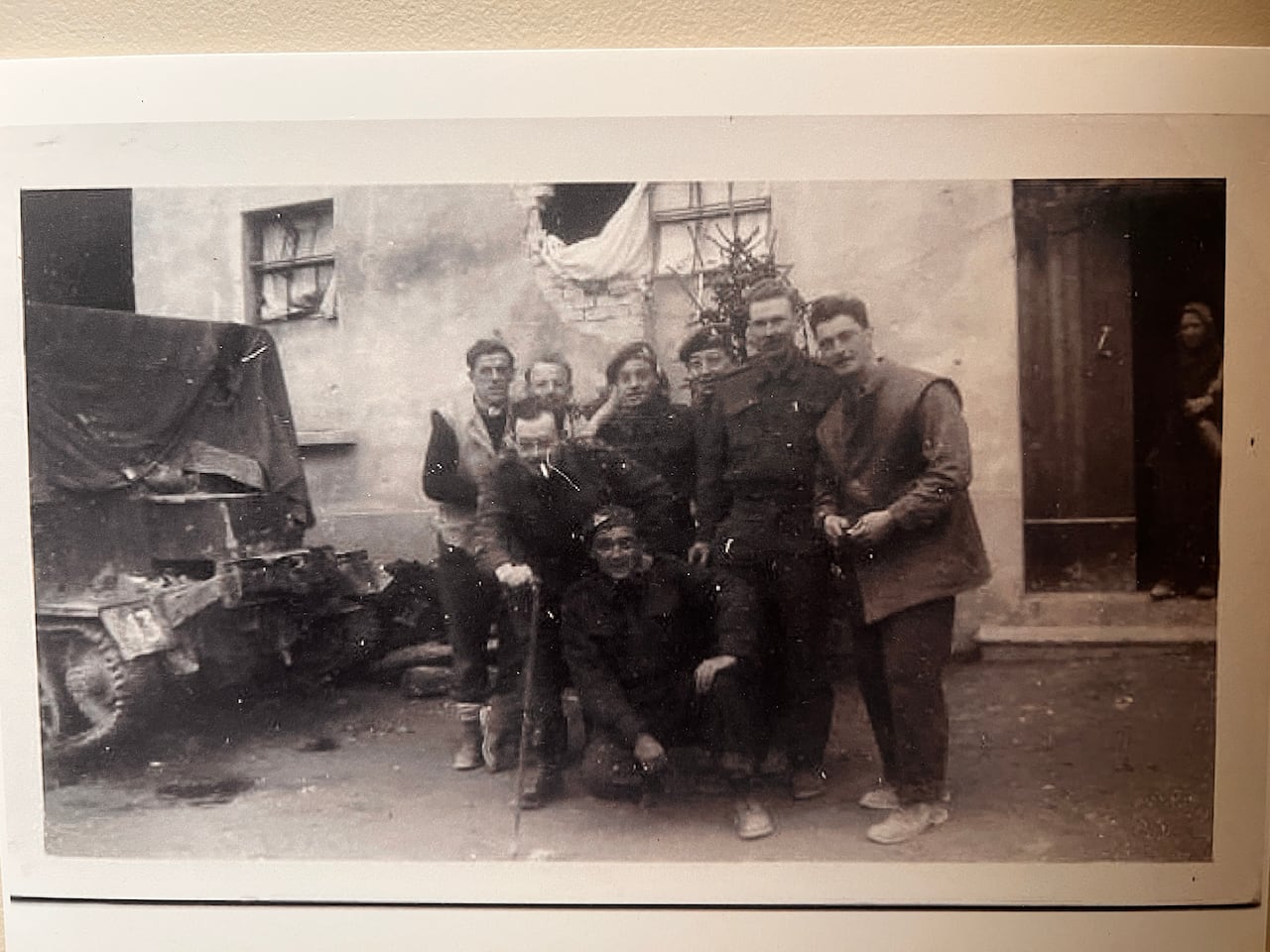 Soldiers together in a black and white photo.
