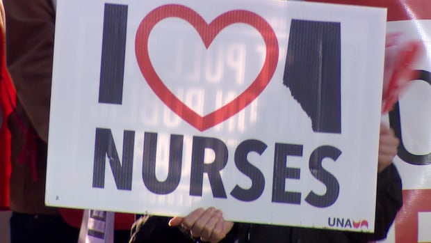 United Nurses of Alberta held day of action rallies across the province on Jan. 25, 2025. A sign with the message "I Love Alberta Nurses" is held up at a support rally in Edmonton.