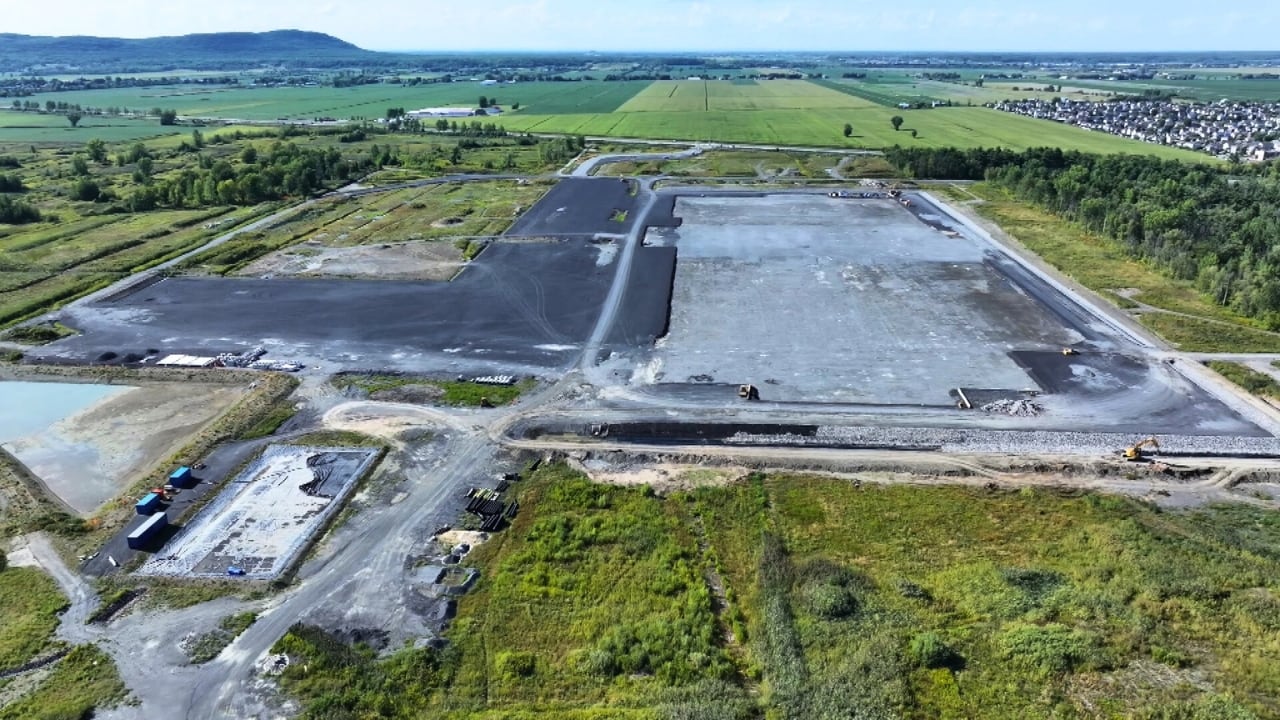 An aerial drone image of a large industrial site with much of the ground surface developed. The site surrounded by rural areas. 