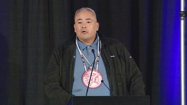 Kirby Constant, Chief of James Smith Cree Nation, says Seth and Rene Constant carried the nation's spirit with pride through their music, inspiring many across their lands and beyond." A man with a long beaded necklace and a collared shirt