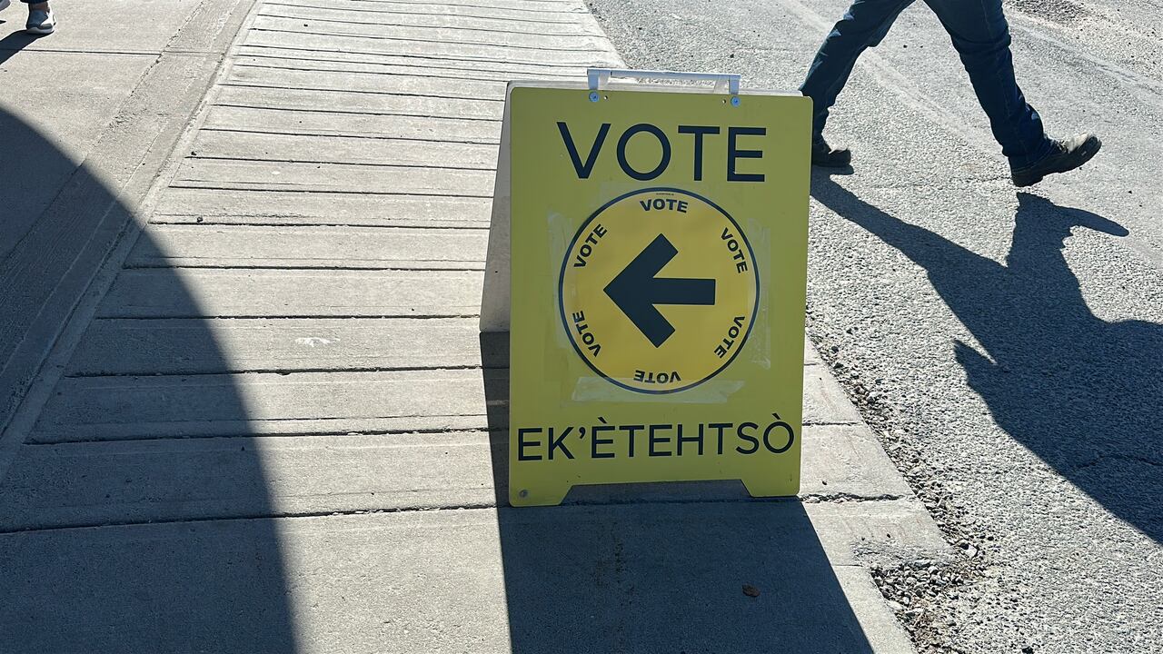 A agleam  yellowish  motion   reads "VOTE" successful  some  English and Tlicho Yatii, a dialect of Dene.