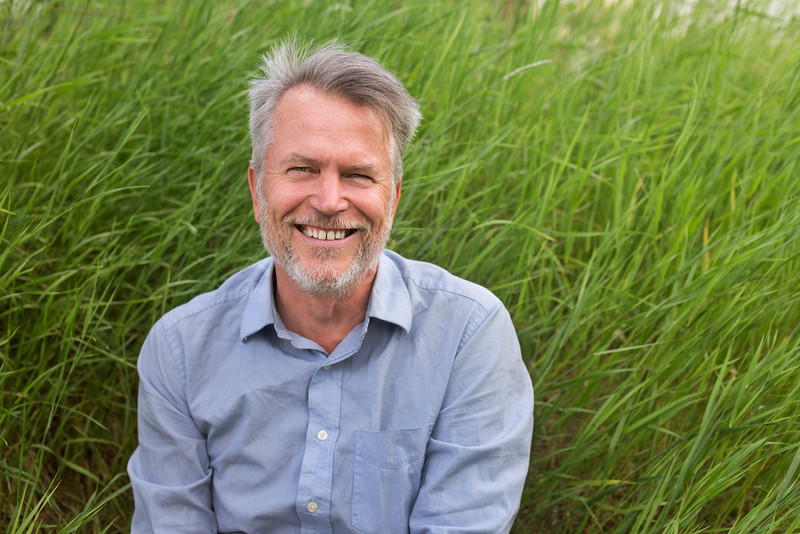 West Dawson resident David Curtis says finally having his volunteer emergency response support group gain association status will allow for more support, resources and training from g overnments A man smiling in tall grass