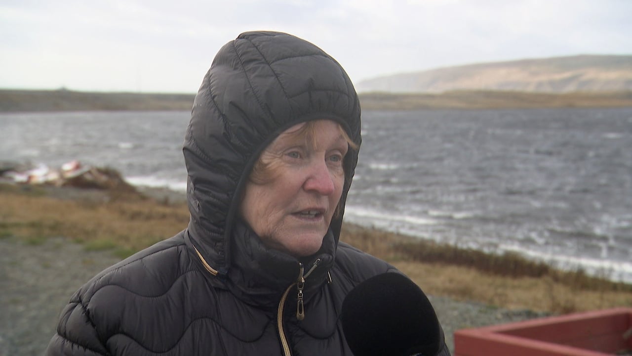 Woman with overgarment  hood up   successful  tempest  