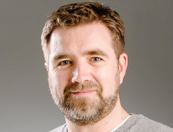 Man wearing beige sweater