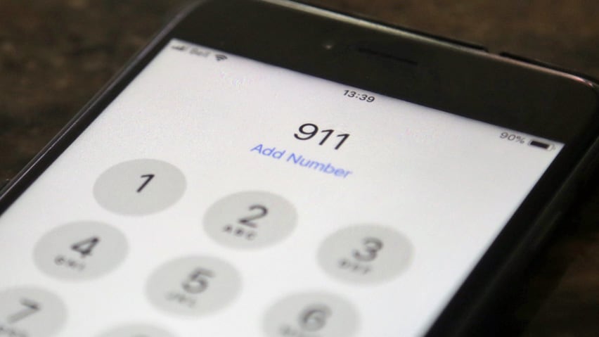 Dialling 911 on a smartphone. The numbers 911 on a cell phone screen.