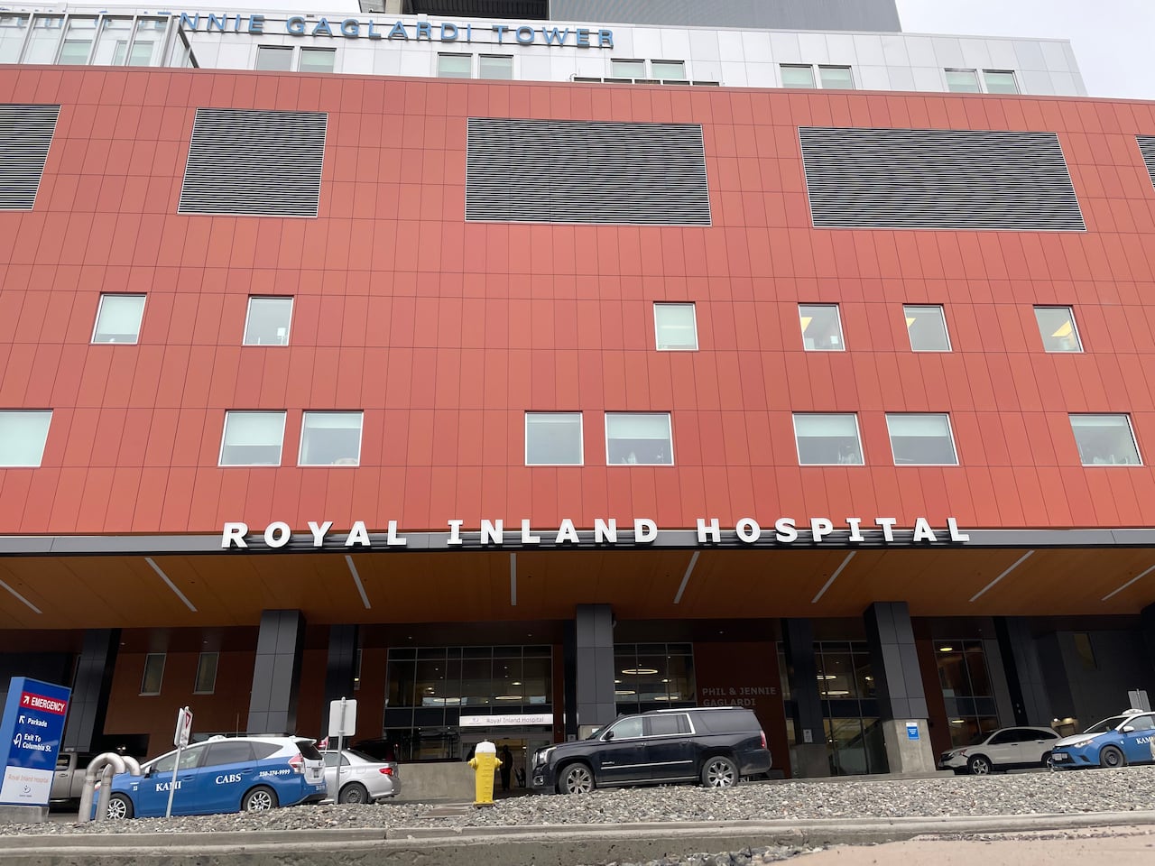 Front of a red building with a sign that reads Royal Inland Hospital