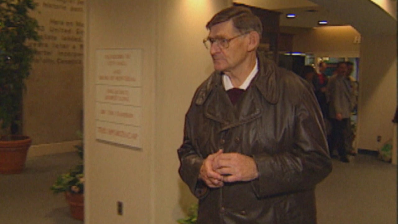 Man in brown leather jacket.