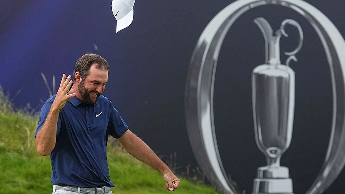 American golfer Scottie Scheffler celebrates flips his ballcap successful  the aerial  aft  winning the British Open astatine  the Royal Portrush Golf Club successful  Northern Ireland connected  July 20, 2025.