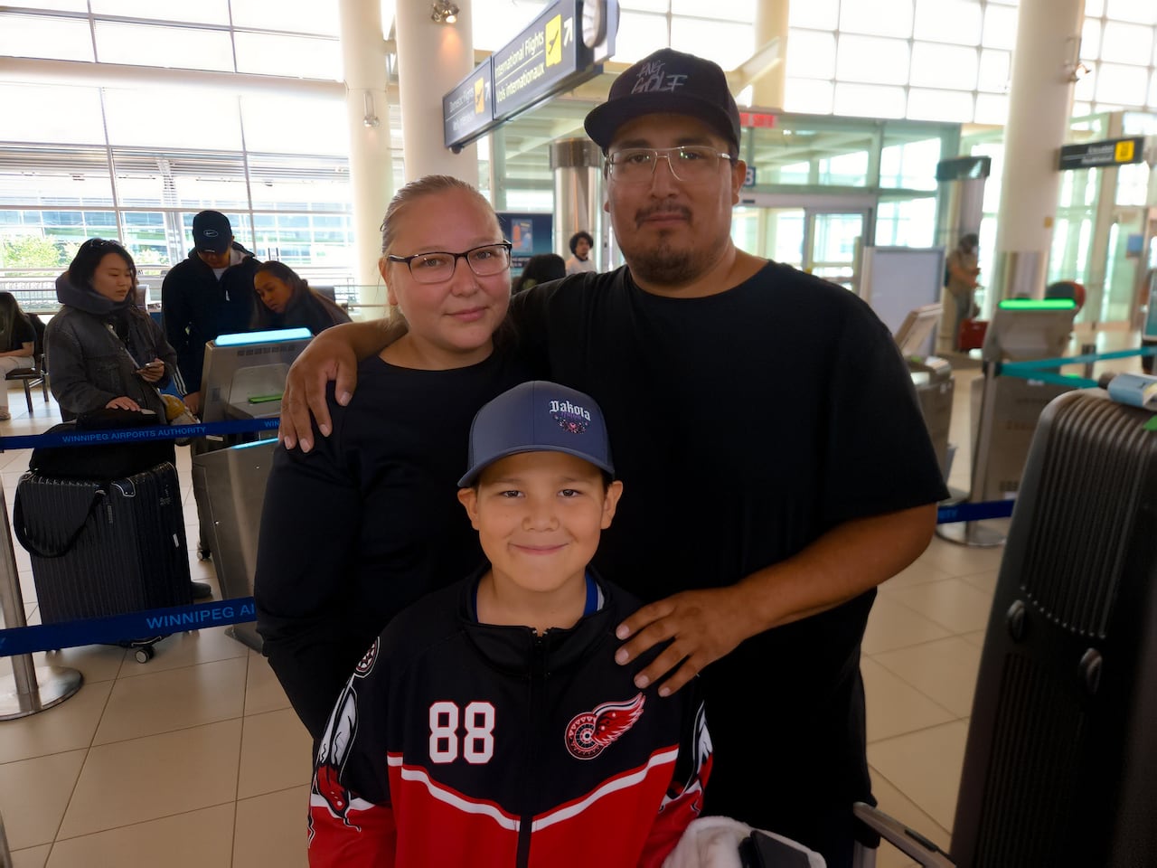 Connor Hanska astatine  the airdrome  leaving for Northern Ireland with his parent  Destiny Jackson and begetter  Doug Hanska.