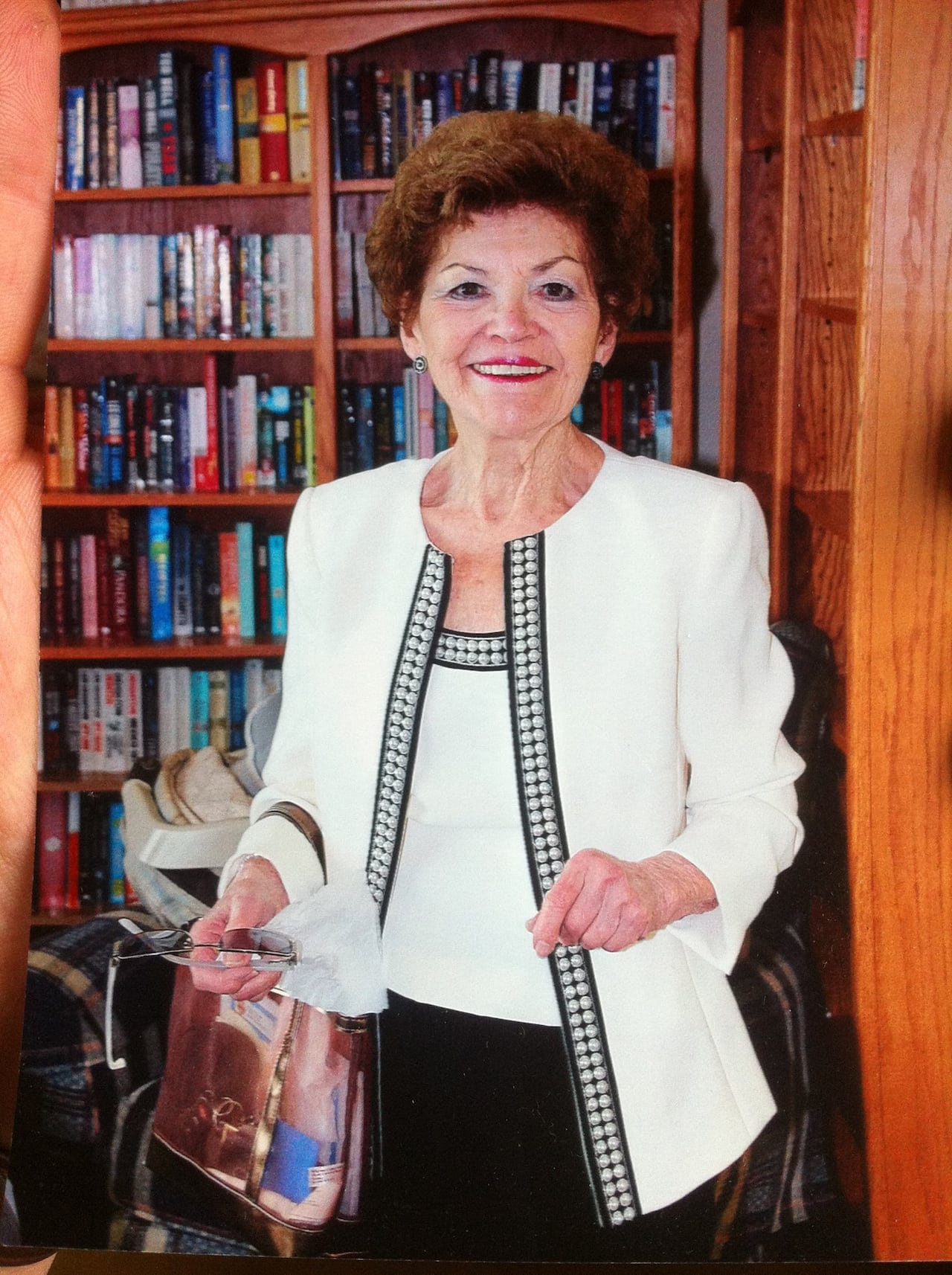 A woman smiles at the camera