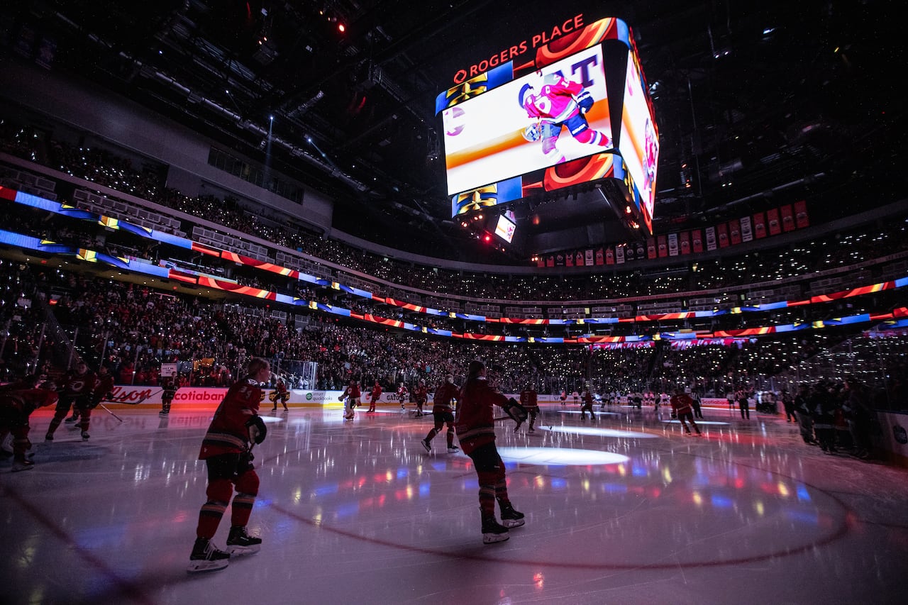 Fans are pictured inside a hockey arena.