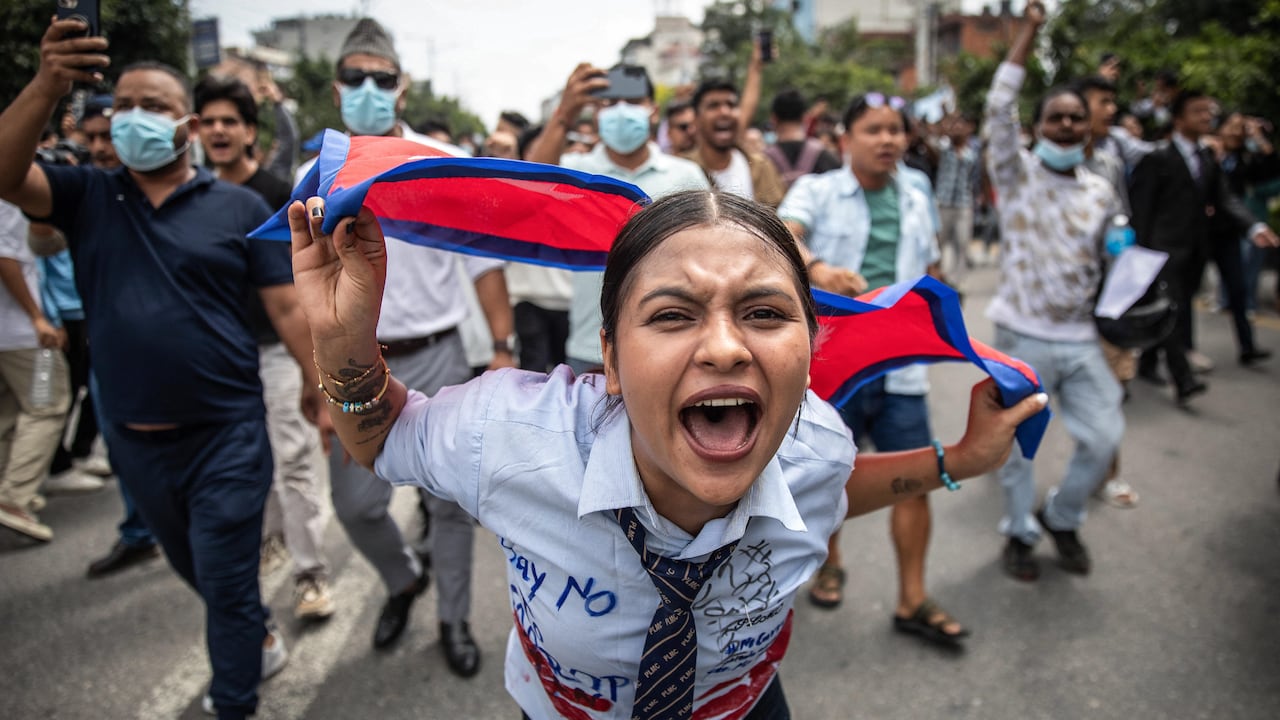 A demonstrator shouts slogans outside Nepal's Parliament, in Kathmandu.