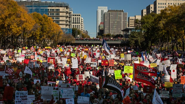 Teachers and supporters take part in a rally on World Teachers' Day in Edmonton on Sunday October 5, 2025. Alberta Teachers Association members voted 89.5% to reject the latest contract offer from the province of Alberta. A group of people.