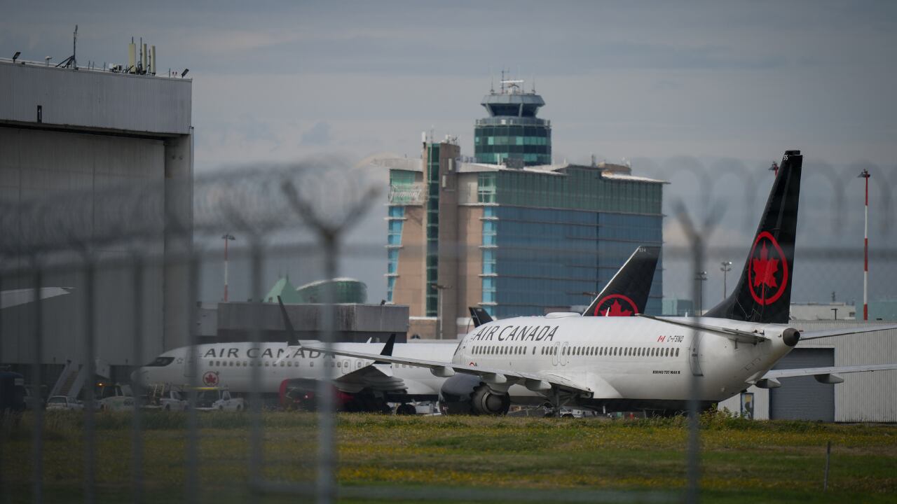 Air Canada planes on the tarmac.