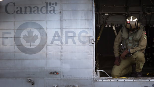 A RCAF crew member prepares for takeoff aboard the CH-124 Sea King helicopter at 443 Maritime Helicopter Squadron in Saanich, B.C., on Tuesday, November 27, 2018.