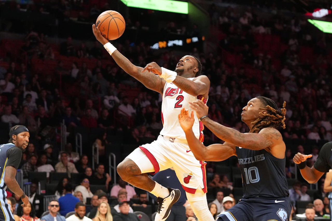 Two men playing active basketball