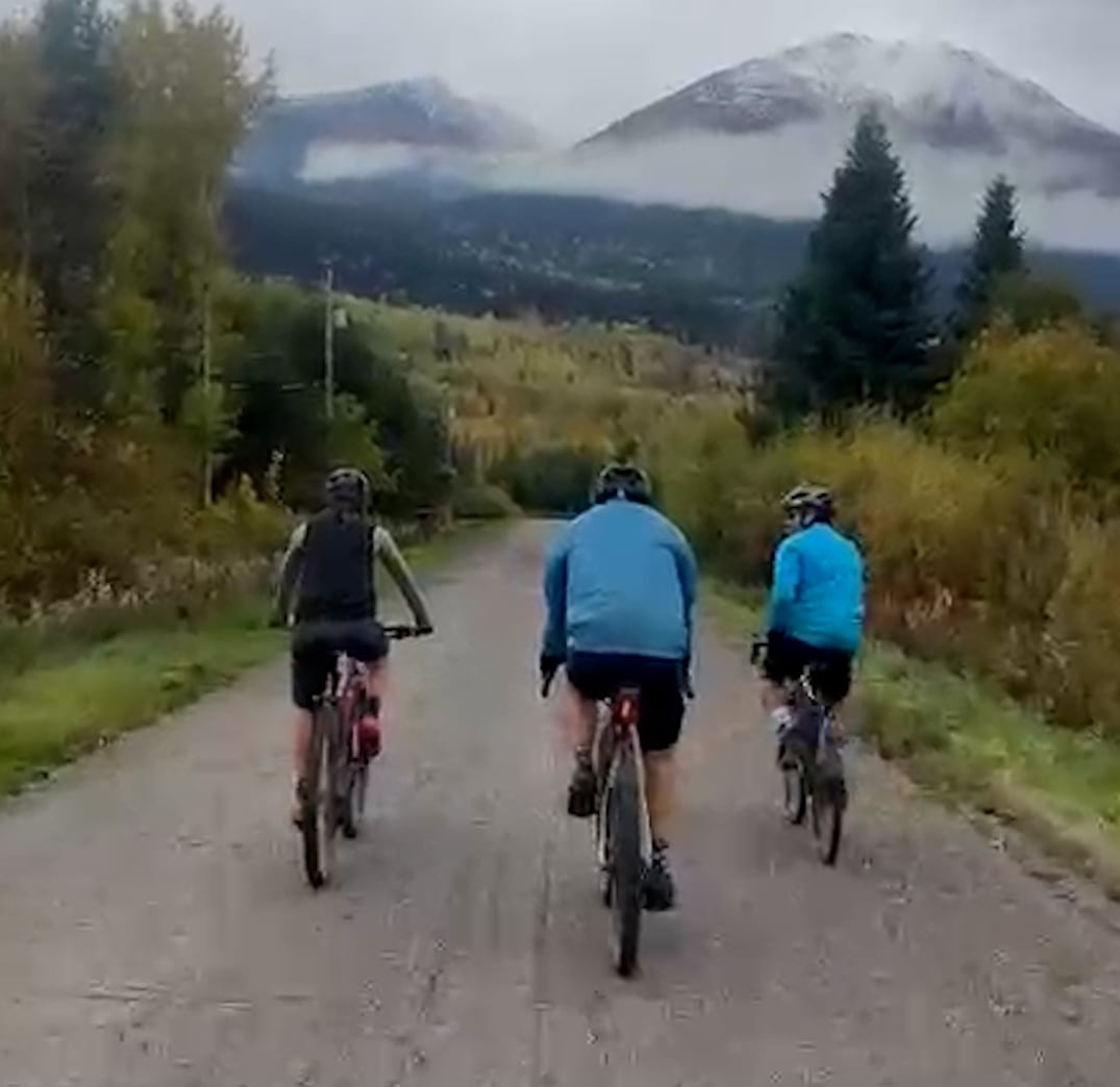 three cyclists on a road