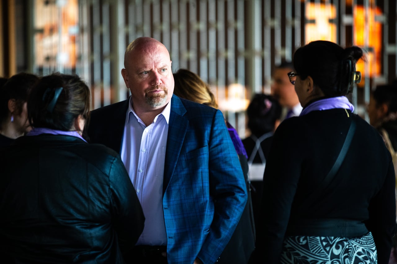 A man stands in a crowd