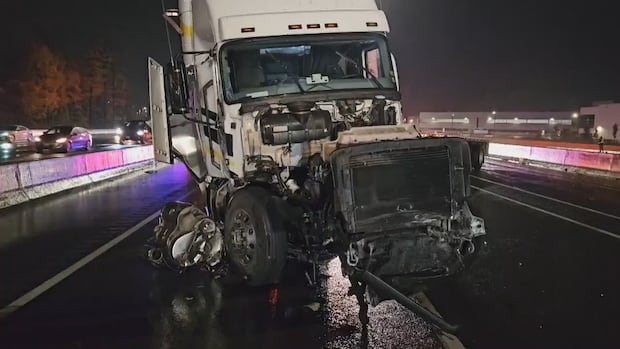 Highway 401 express lanes reopened after tractor-trailer smashed highway median: OPP | CBC News