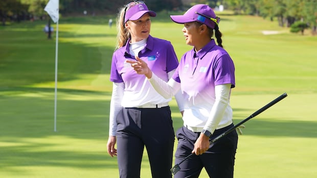 Brooke Henderson and Hsu Wei-ling talk after their victory for Team World and clinching a spot in the semifinals of the International Crown.