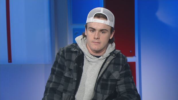 Charlottetown Islander Ross Campbell A short haired man in a backward baseball cap sits in a television studio