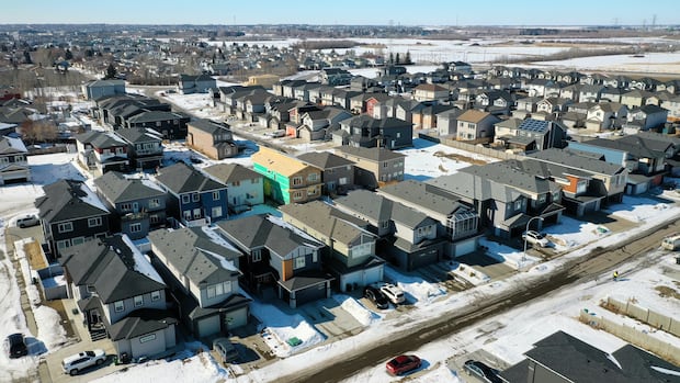 Aerials of some new homes under construction in Edmonton An overhead view of partially constructed houses in the winter.
