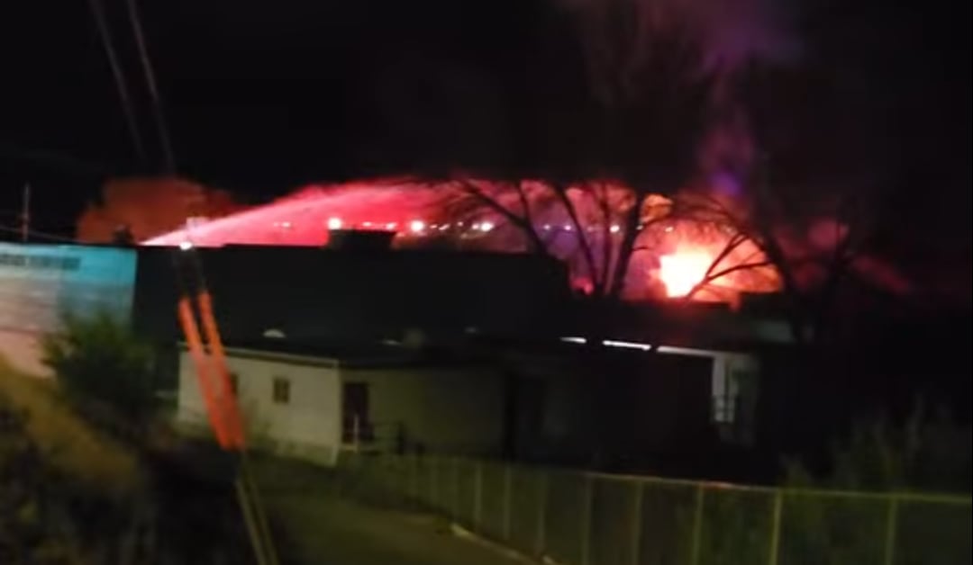 A occurrence is seen with flashing lights and a watercourse of h2o astatine night.