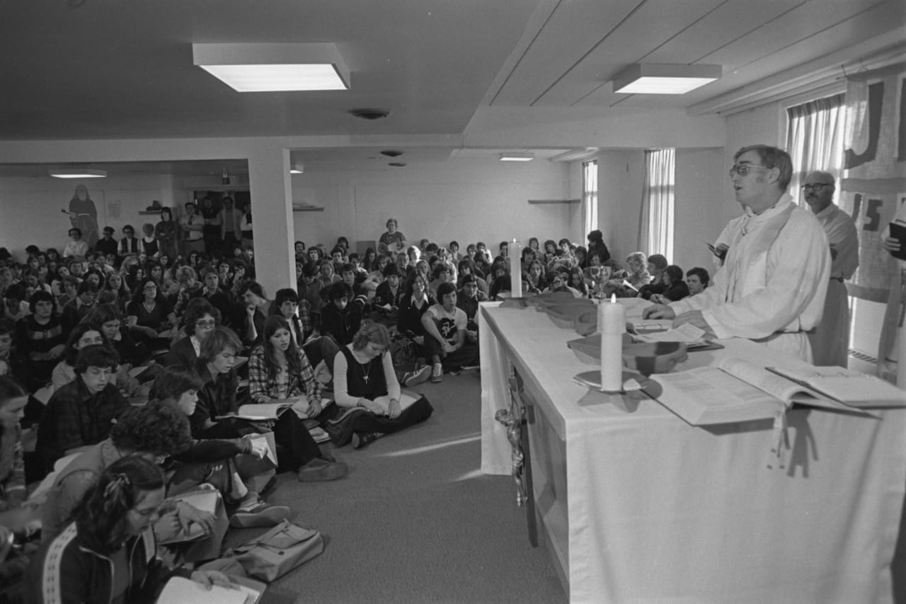 Father Len Lunney leads mass at St. Pius X High School on Oct. 28, 1975, the day after the shooting.