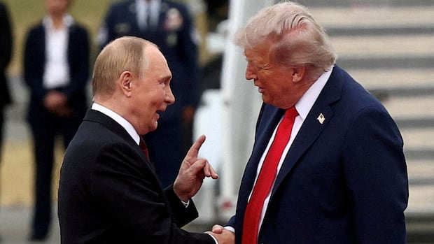 U.S. President Donald Trump shakes hand with Russian President Vladimir Putin, as they meet to negotiate for an end to the war in Ukraine, at Joint Base Elmendorf-Richardson in Anchorage, Alaska, on Aug. 15, 2025. Two men in suits shake hands