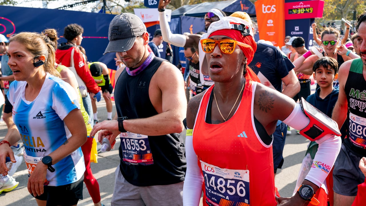Runners cross the finish line of a marathon
