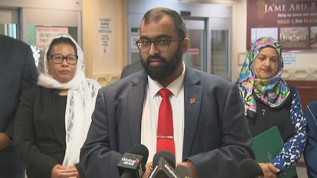 Omar Khamissa, the chief mobilization officer for National Council of Canadian Muslims (NCCM), said the assault of a Muslim man while working at a hotel in Markham at the end of last month is one of the worst hate-motivated attacks he's ever heard of. A man speaks at a news conference while wearing a suit.