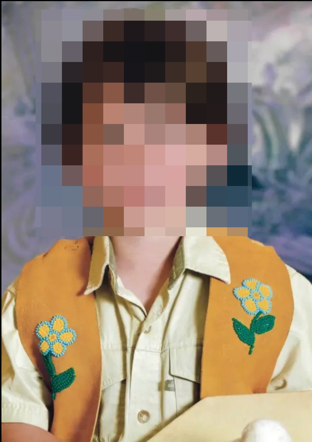 A blurred portrait of a child.