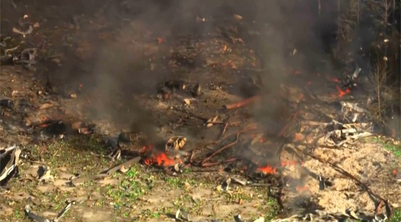 Smoke and debris in a field