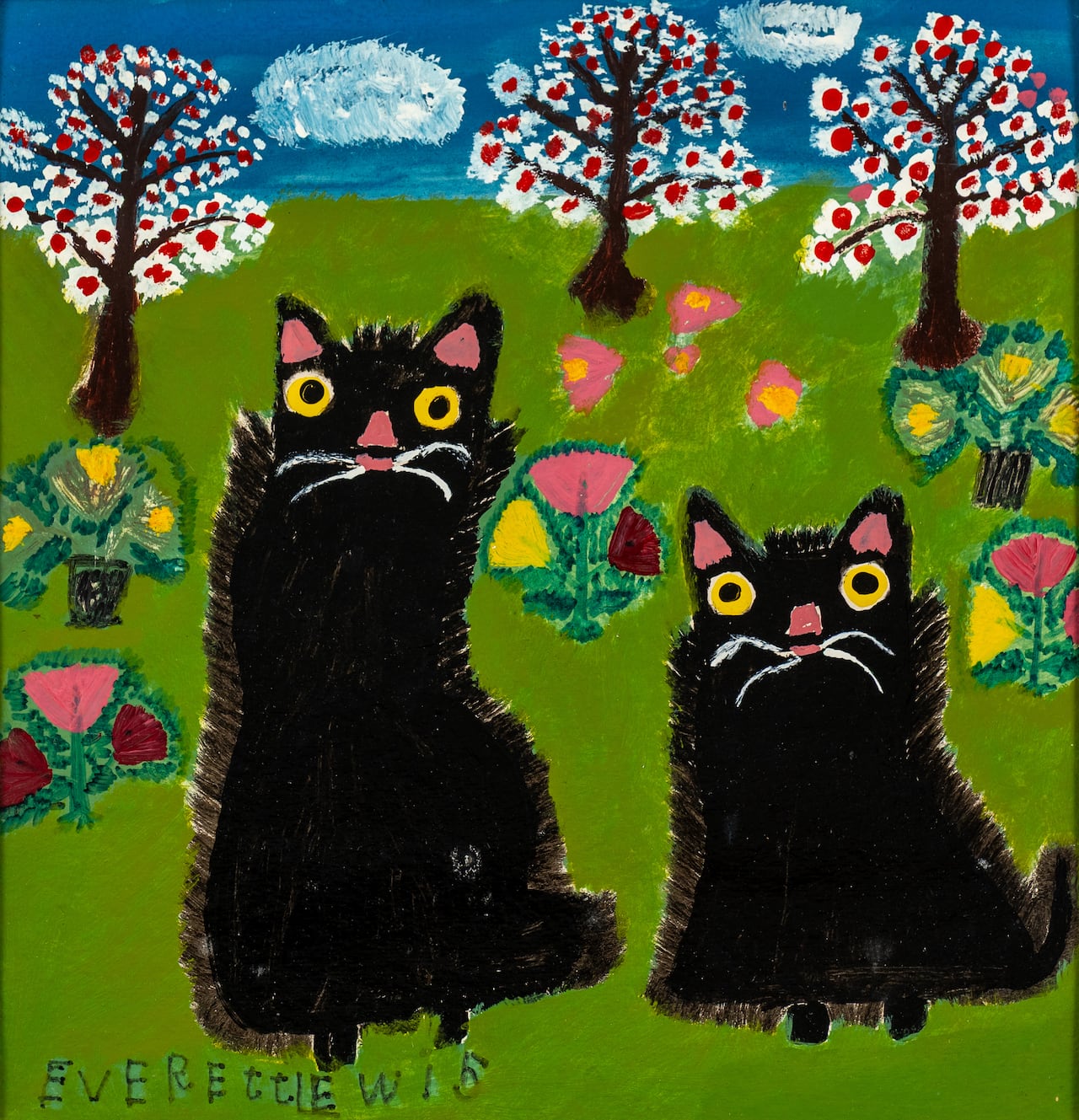 Two black cats are shown in a painting.