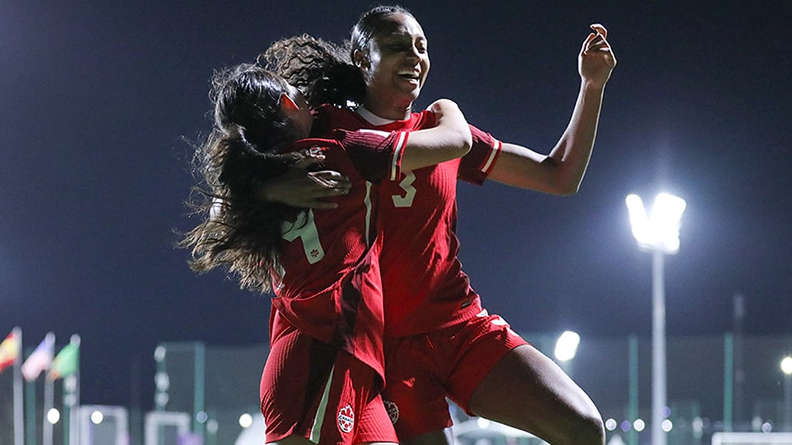 Canadian Under-17 soccer players Daniela Feria-Estrada and Mya Angus celebrate a goal in their team’s 6-0 win over Zambia in Round of 16 play at the FIFA World Cup in Sale, Morocco on October 29, 2025.