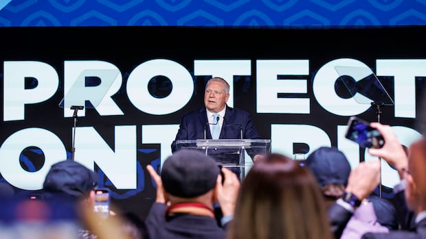 Ontario Premier Doug Ford celebrates his party's snap election win, the Progressive Conservatives third straight majority government, at the Toronto Congress Centre, in Etobicoke, on Feb. 27, 2025. A man stands at a podium in front of a large crowd.
