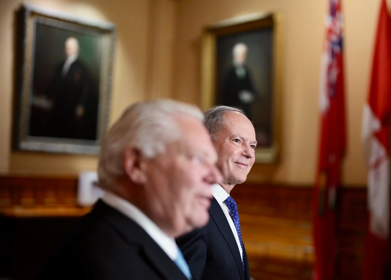 Two men successful suits smiling and walking together