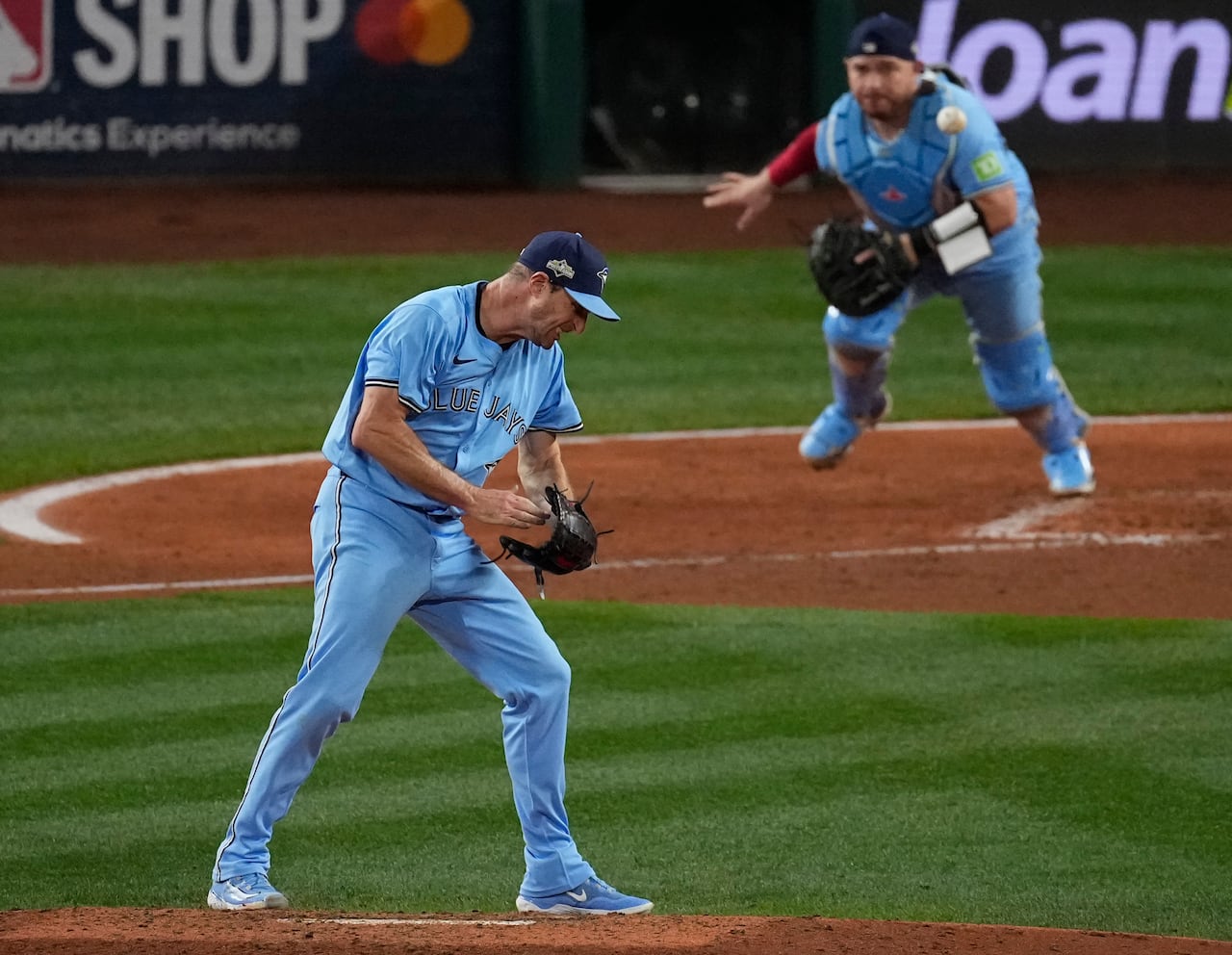 A baseball pitcher reacts after striking out his opponent.
