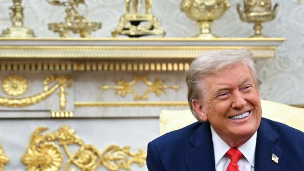 A man with gold decor behind him