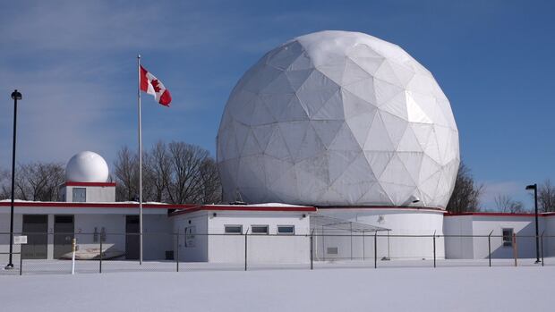 This radome houses a giant satellite dish that used to be owned by NATO. Now it's privately owned and used by a local group of radio astronomers. A giant golf-ball looking dome sits atop several small buildings.