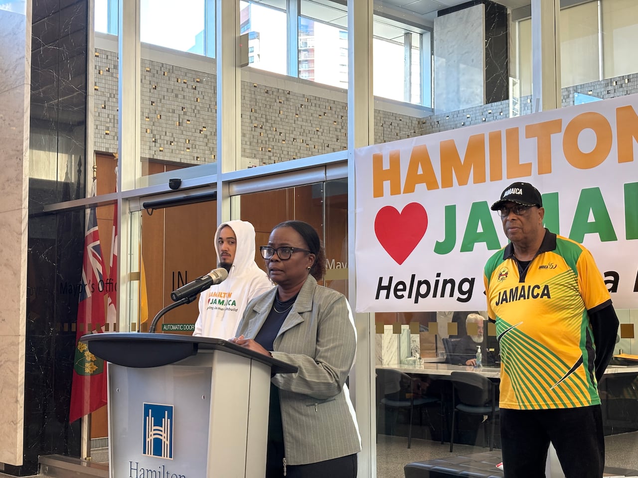 A pistillate   speaks astatine  a podium