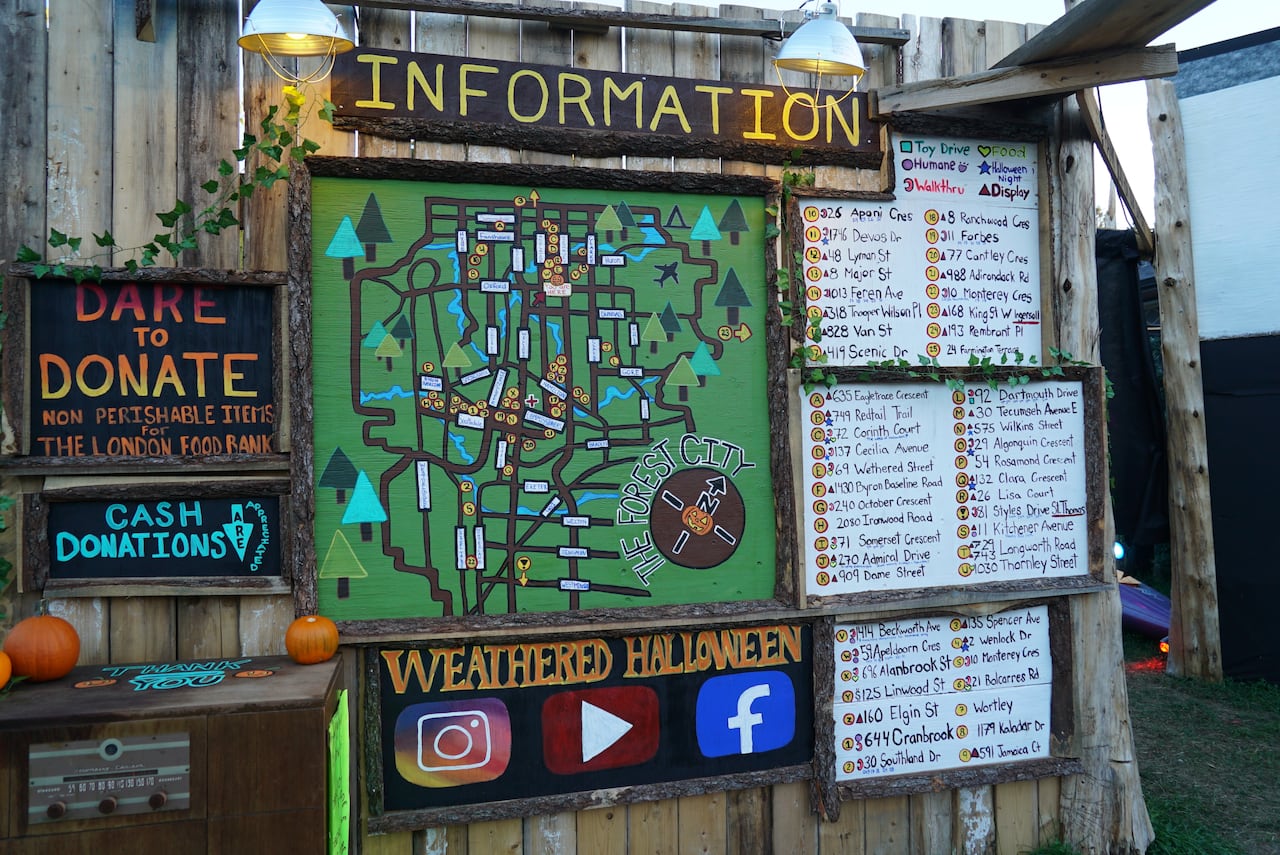 This information board includes a hand-curated, and hand-painted map of spooky displays across the city.